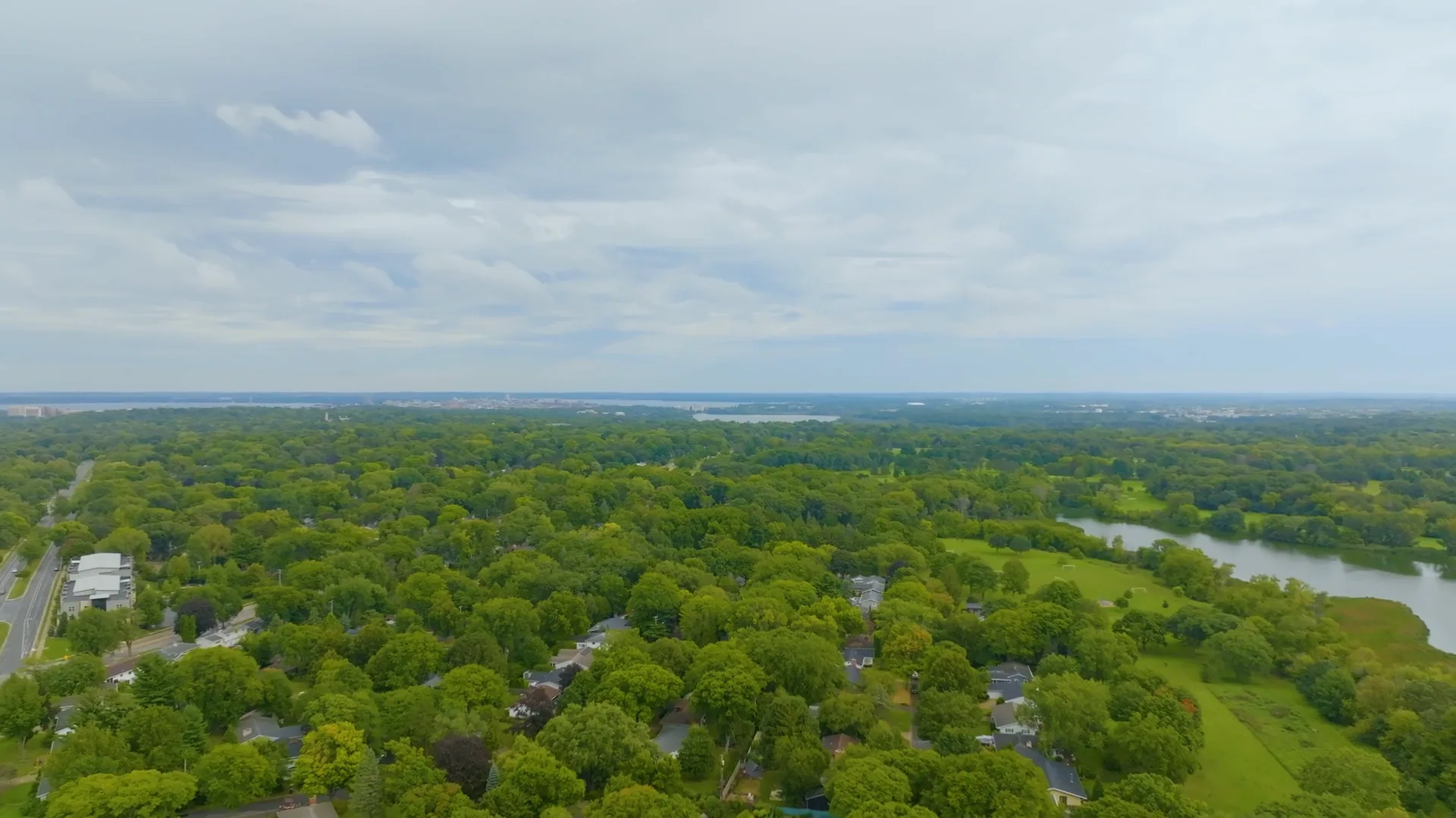 Aerial view of Madison, Wisconsin with the Yahara River and tree-covered neighborhoods